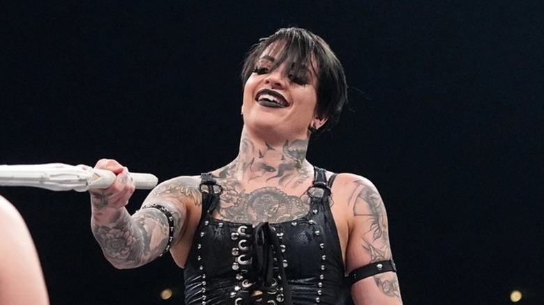 Ruby Soho holds up a kendo stick