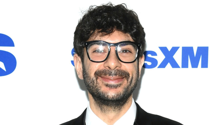 Tony Khan in front of the Sirius XM logo
