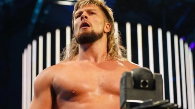 Brian Pillman Jr. poses on the stage before heading down to the ring in AEW.