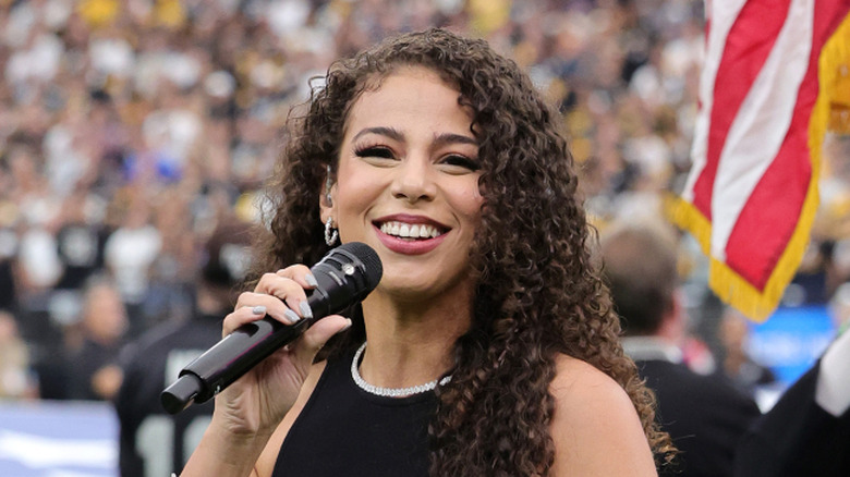 Samantha Irvin singing the national anthem at an NFL game