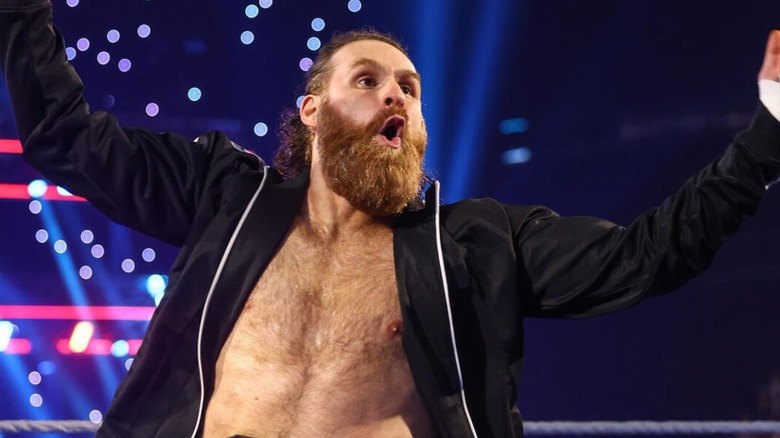 Sami Zayn poses in the ring before his United States Championship open challenge on 
