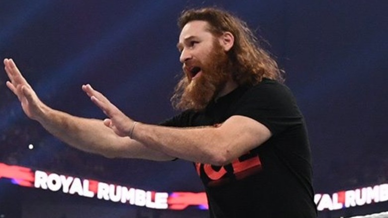 Sami Zayn pleading for mercy