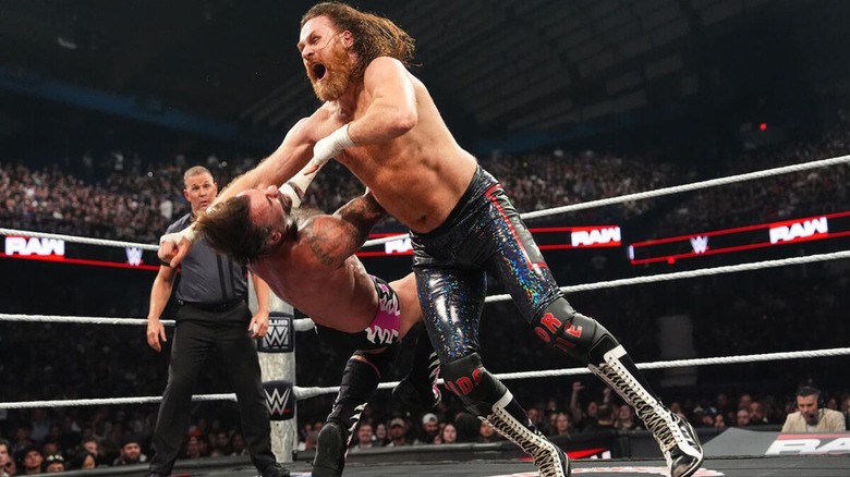 Undisputed WWE Champion Sami Zayn delivers a forearm to opponent CM Punk during their match for the title on the July 6, 2026 edition of 
