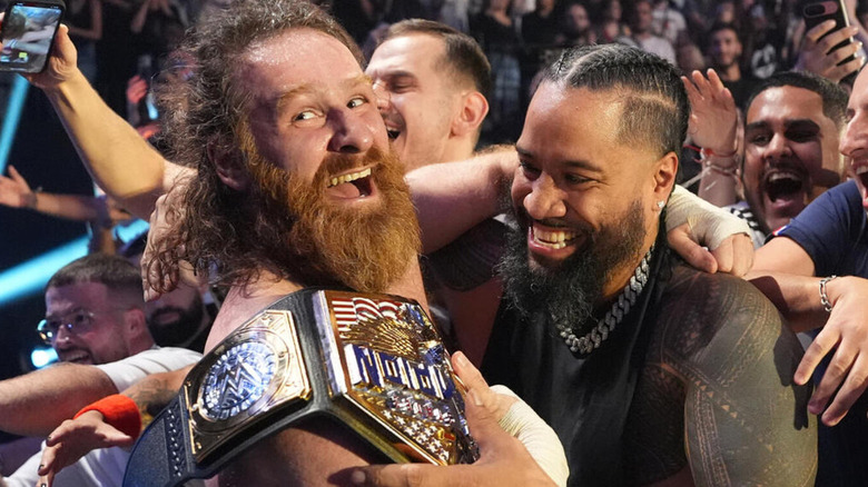 Sami Zayn celebrates his United States Championship victory alongside Jimmy Uso and the WWE Universe.