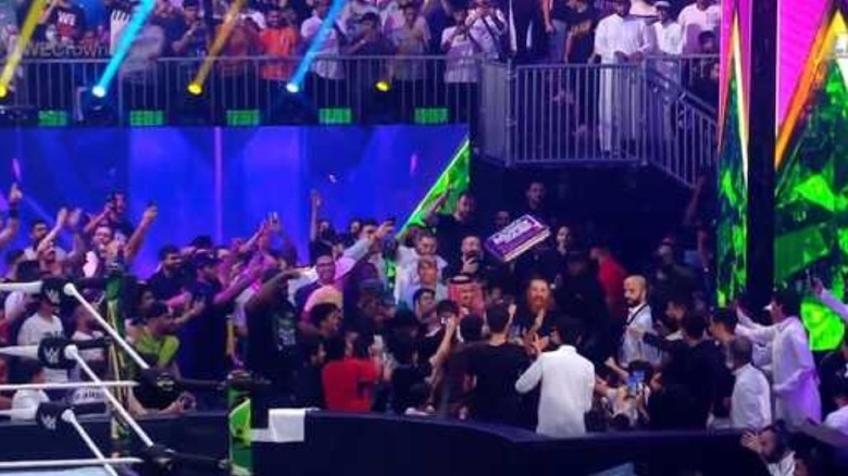 Sami Zayn holding the briefcase