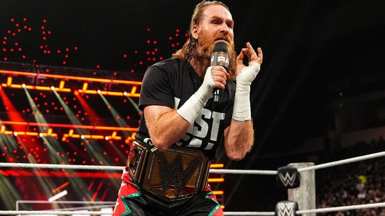 Undisputed WWE Champion Sami Zayn cuts a promo in the middle of the ring during the opening segment of 