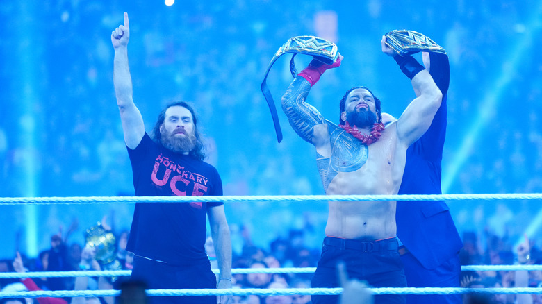 Sami Zayn posing with Roman Reigns