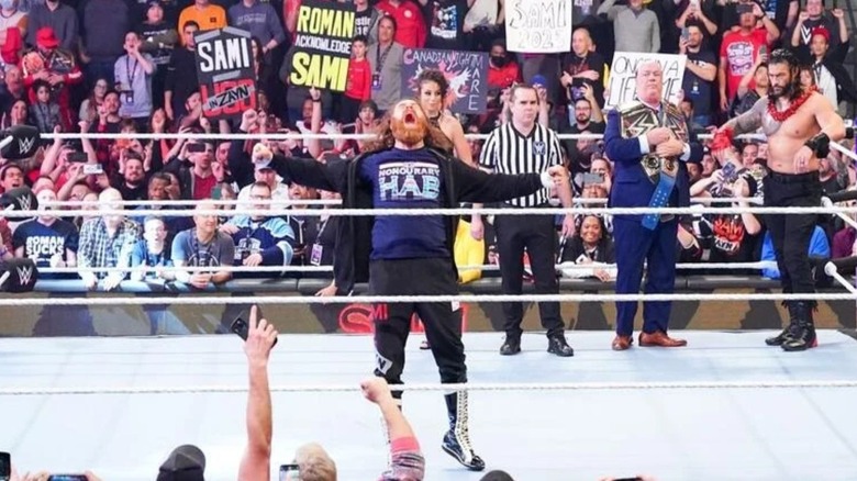 Sami Zayn poses in the ring in front of his hometown Montreal crowd ahead of his title match against Roman Reigns at WWE Elimination Chamber 2023.