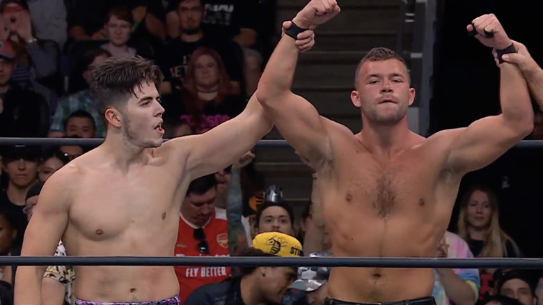 Sammy Guevara and Daniel Garcia raise their hands in victory