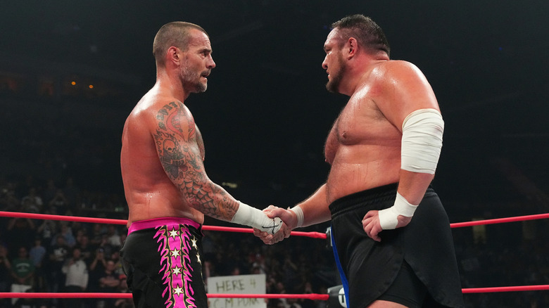 CM Punk shakes Samoa Joe's hand