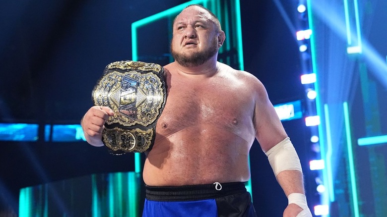 Samoa Joe with the AEW World title