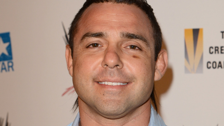 Santino Marella grinning with a wound under his eye