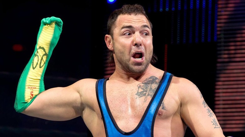Santino Marella getting ready to hit his 'The Cobra' Finisher with his signature sock puppet.