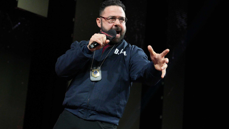 Santino Marella holding a microphone