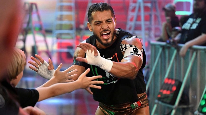 Santos Escobar high-fiving fans