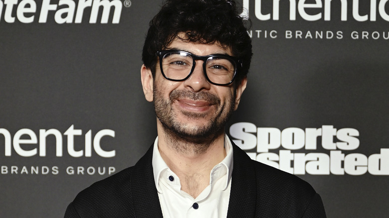 Tony Khan wearing glasses