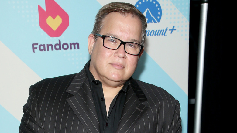 Scott D'Amore in a black suit with glasses on