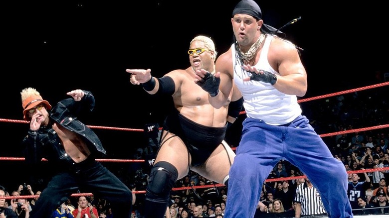Scotty 2 Hotty, Rikishi, and Grand Master Sexay all dancing together during a WWE show.
