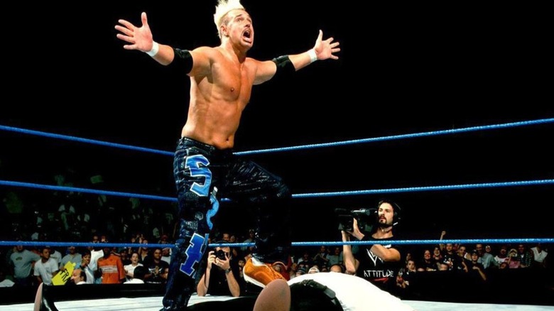 WWE star Scotty 2 Hotty gears up to do The Worm during a match on an edition of 