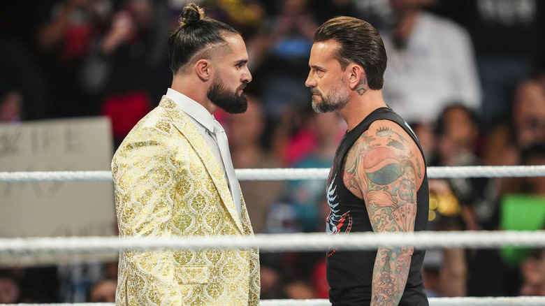 Seth Rollins and CM Punk in the ring