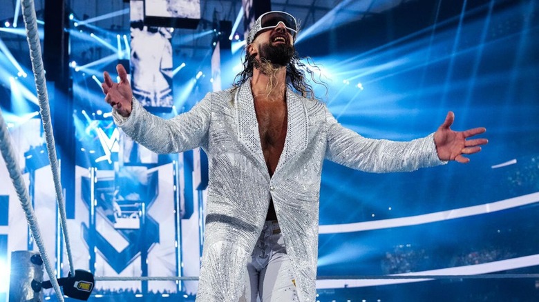 Seth Rollins parades around the ring during his entrance ahead of his match against Roman Reigns and CM Punk on night one of WWE WrestleMania 41.