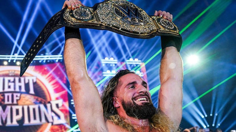 Seth "Freakin" Rollins holding up the World Heavyweight Championship