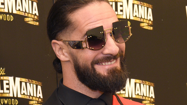 Seth Rollins smiling in shades