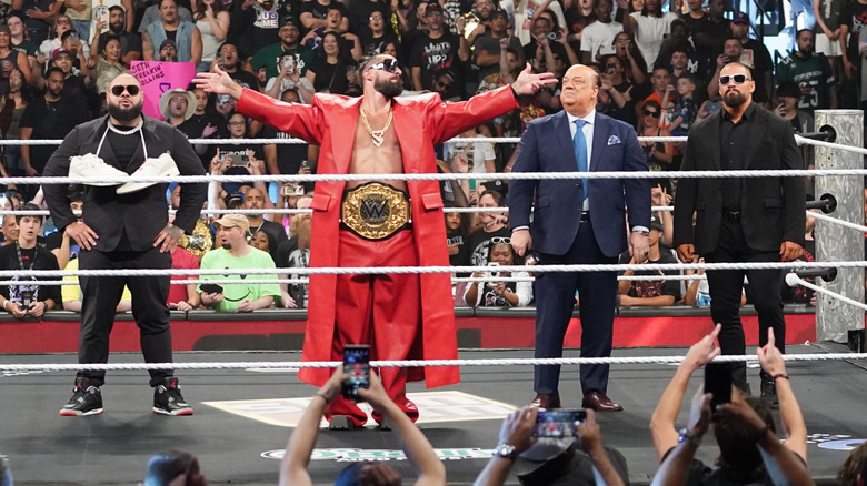 Seth Rollins and The Vision in the ring
