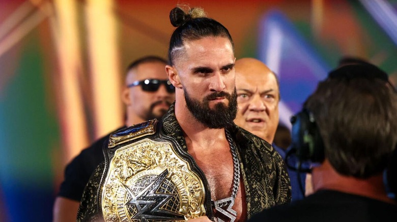 World Heavyweight Champion Seth Rollins heads down to the ring flanked by Paul Heyman and Bron Breakker on an episode of 