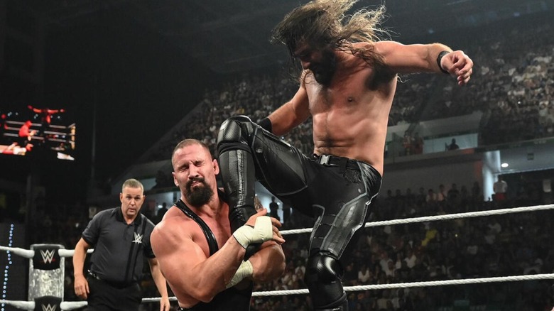 Seth Rollins hits a knee to the face of Bron Breakker in the middle of the ring during the June 1, 2026 edition of 