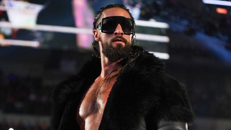 Seth Rollins posing on the apron