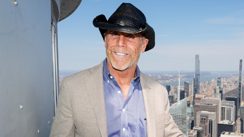 Shawn Michaels standing in a New York City skyscraper