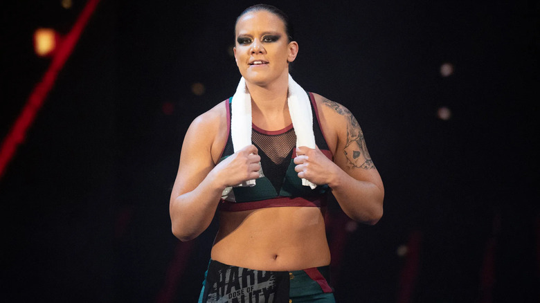 Shayna Baszler wearing a white towel around her neck