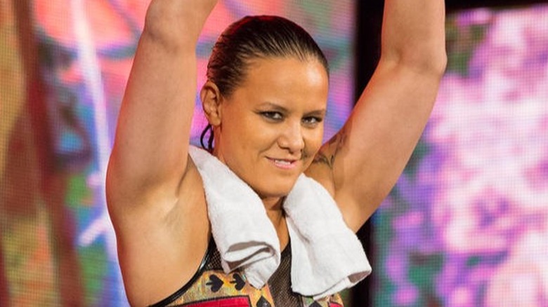 Shayna Baszler with arms up