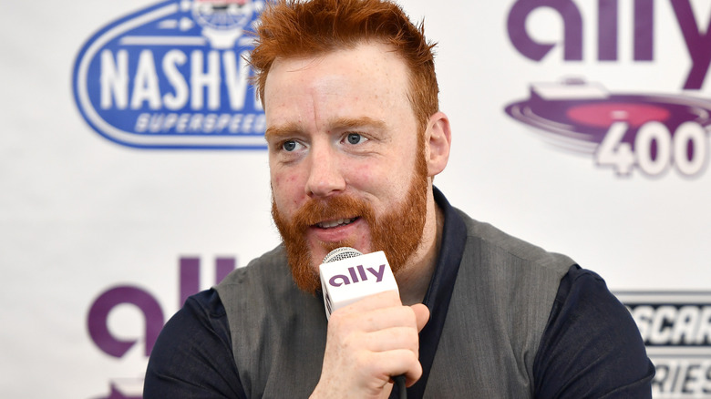 Sheamus holding a microphone