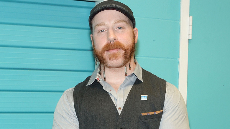 Sheamus wearing a gray vest