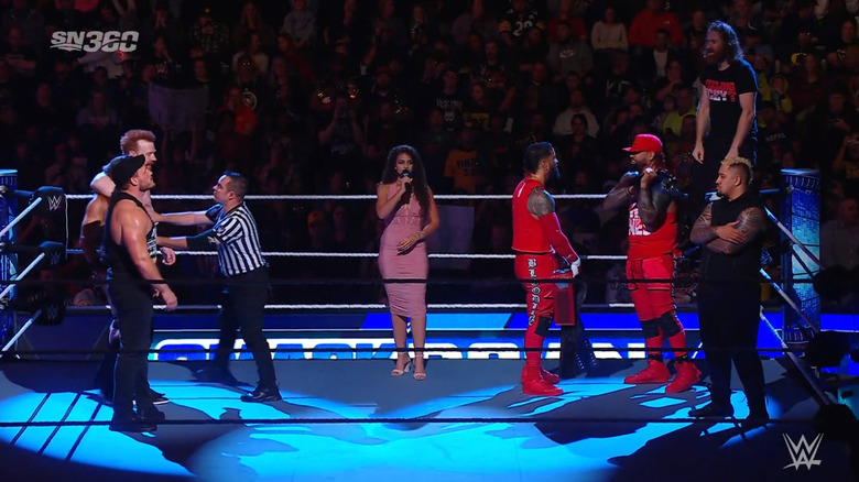 The four men and their allies facing off in the ring