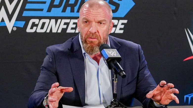 Triple H fielding questions at a press conference