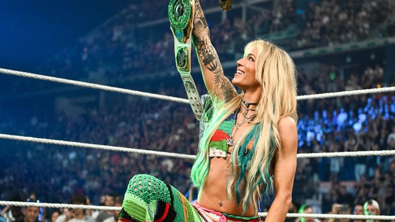 Sol Ruca raises the Women's Intercontinental Championship in the ring before a promo segment on 