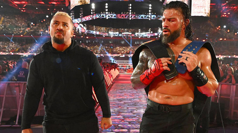Solo Sikoa escorts Roman Reigns after Clash at the Castle