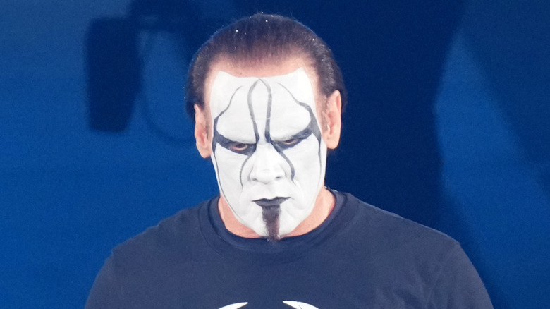 A solemn Sting makes his entrance for his last match in Japan