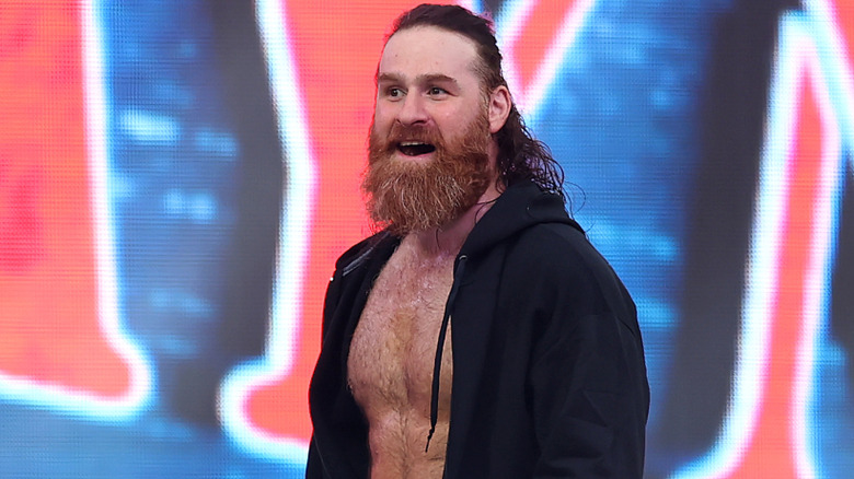Sami Zayn is wearing a black hoodie