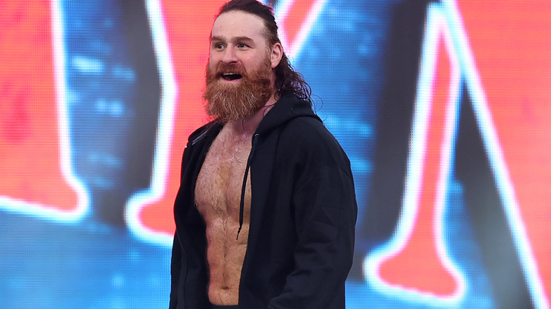 Sami Zayn is wearing a black hoodie