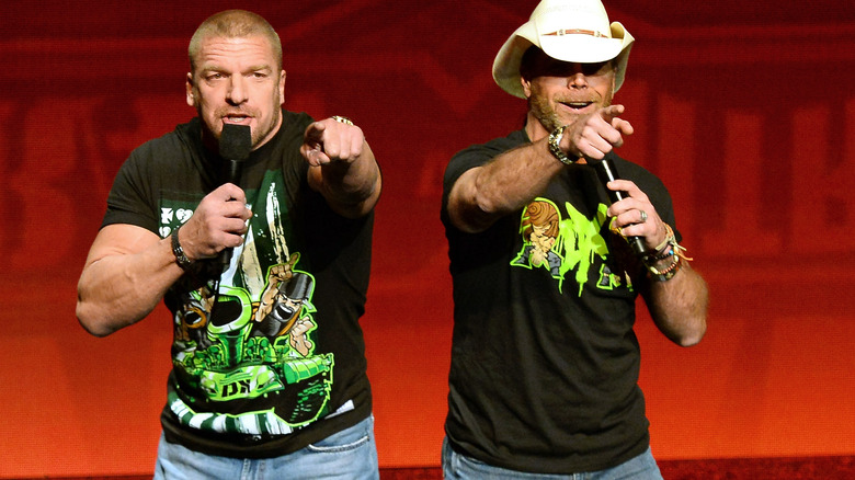 Paul Levesque and Shawn Michaels pointing
