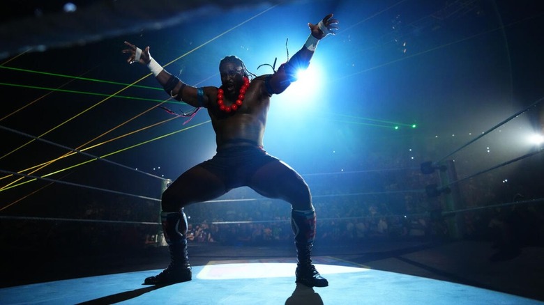 Oba Femi hits his pose in the middle of the ring during a segment on 