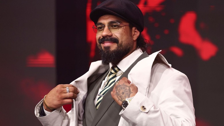 Andrade wearing a black hat