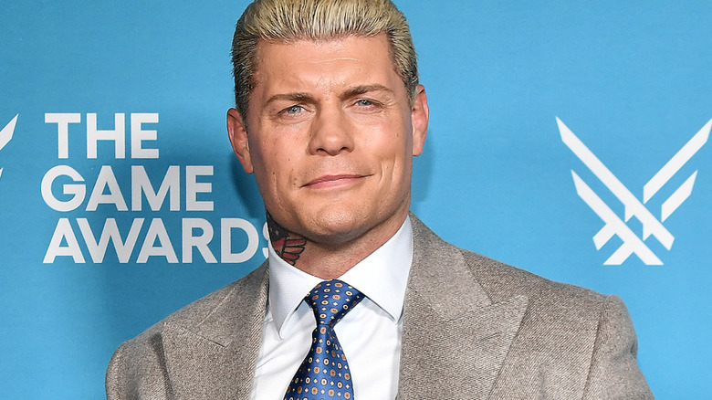Cody Rhodes wearing a suit