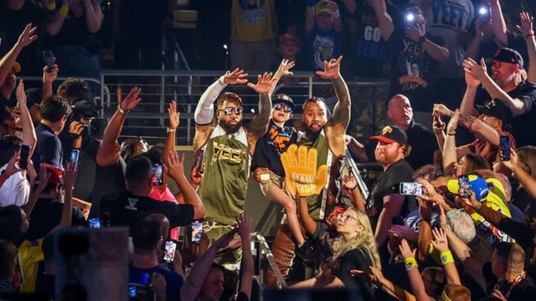 The Usos hits the "YEET" in the crowd during their entrance at Wrestlepalooza.