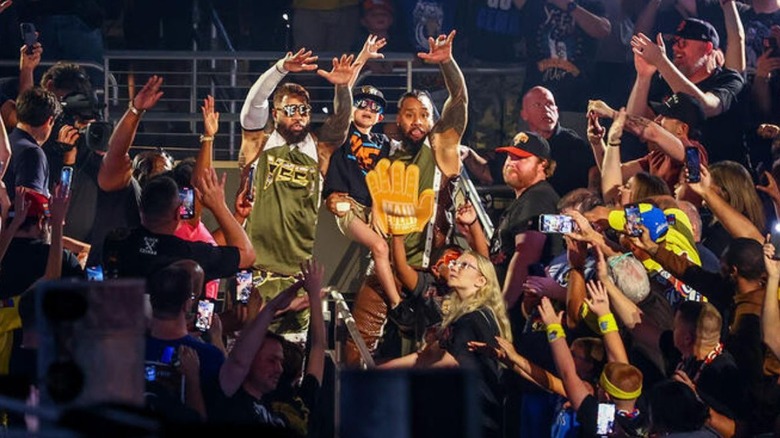 The Usos hits the "YEET" in the crowd during their entrance at Wrestlepalooza.