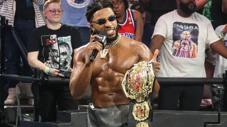 Trick Williams cuts a promo at ringside on 